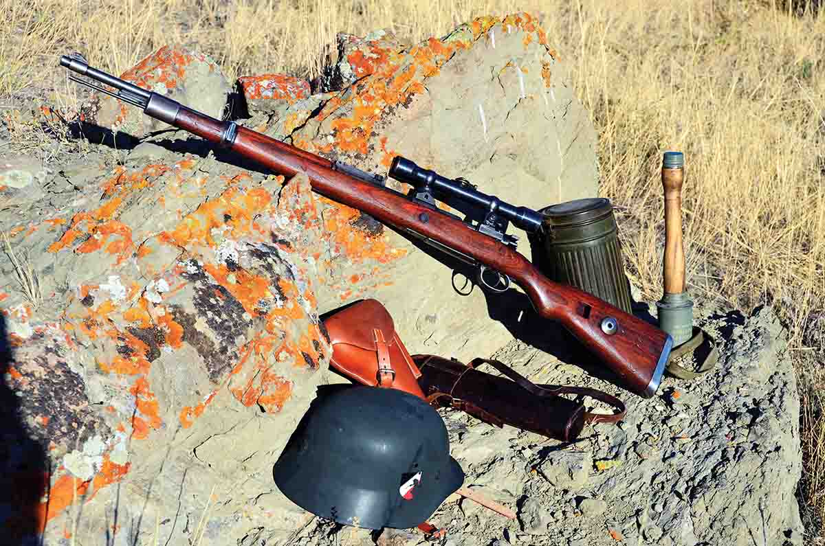 This German K98k sniper rifle is equipped with turret mounts. Note the leather case in which the scope was carried until going into battle.